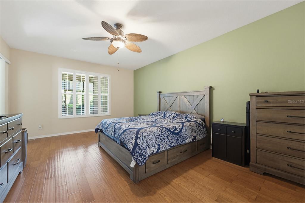 62 Camelot Ridge Drive Brandon, FL 33511 - Photo 23 of 71 a bedroom with a bed and wooden floor