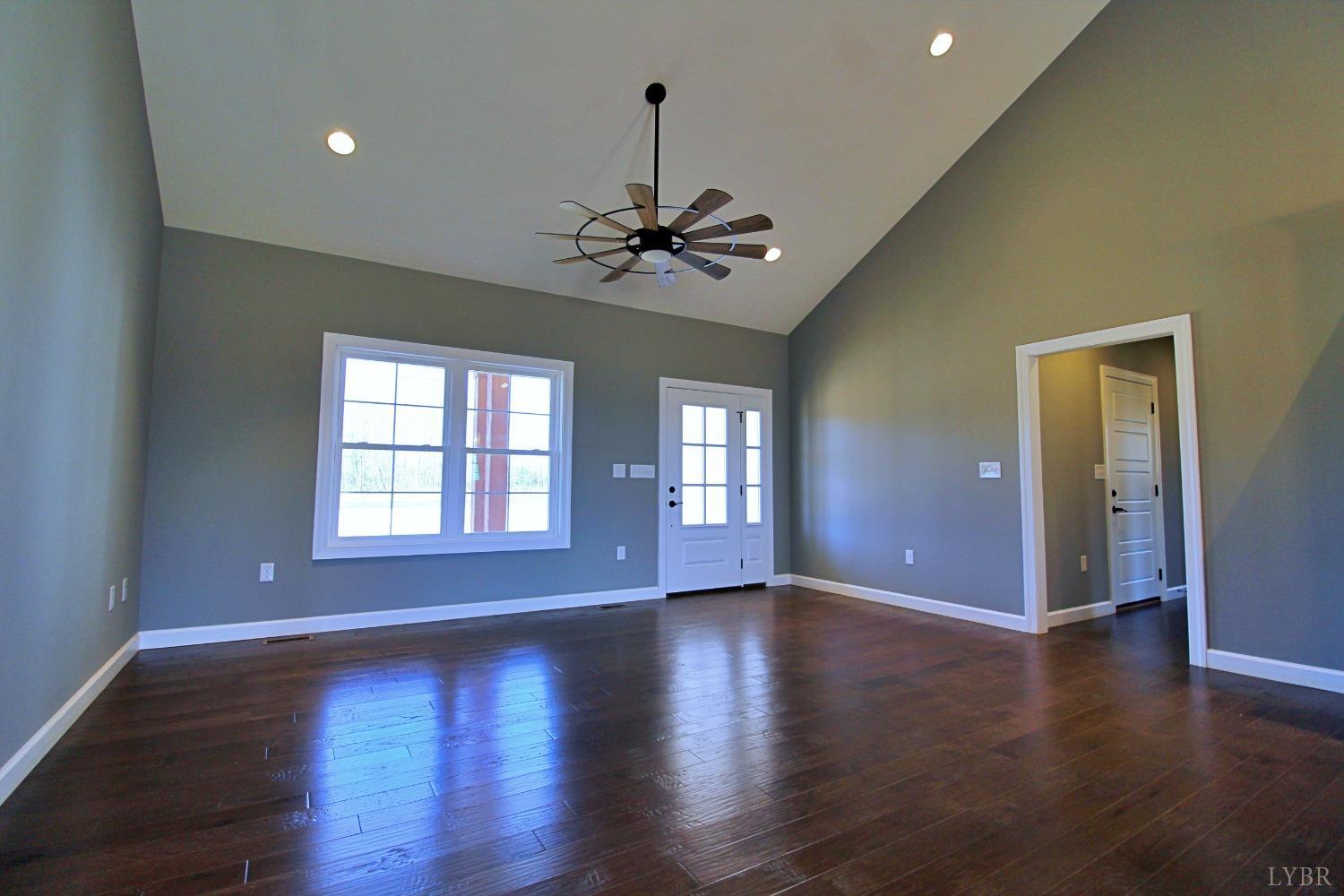 3370 Promise Land Road Appomattox, VA 24522 - Photo 7 of 29 a view of an empty room with a window and wooden floor