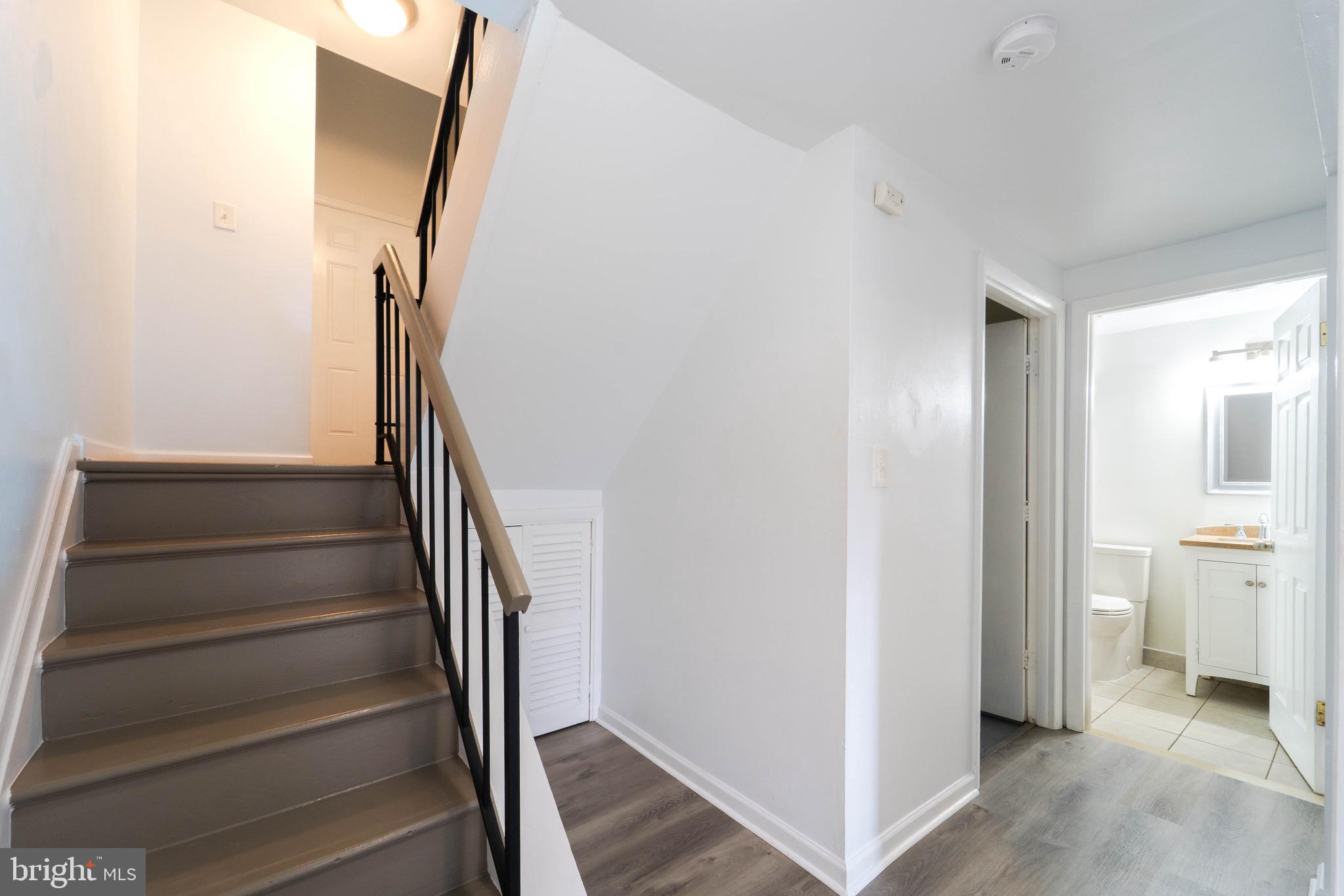 9318 Matador Road Columbia, MD 21045 - Photo 14 of 32 a view of entryway with wooden floor and stairs