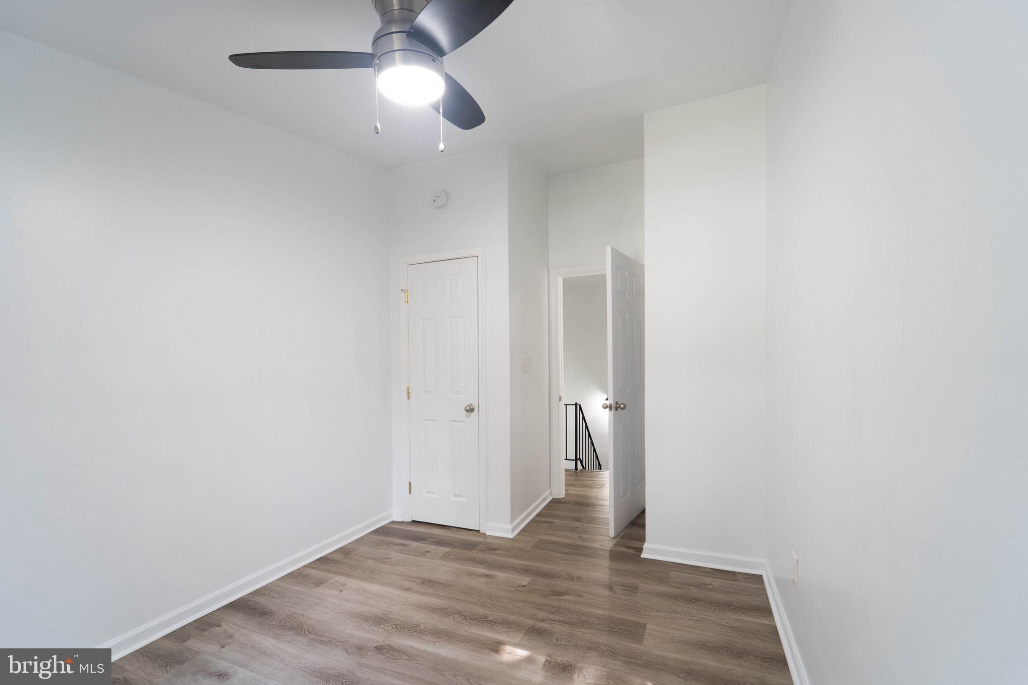 9318 Matador Road Columbia, MD 21045 - Photo 24 of 32 a view of an empty room and wooden floor
