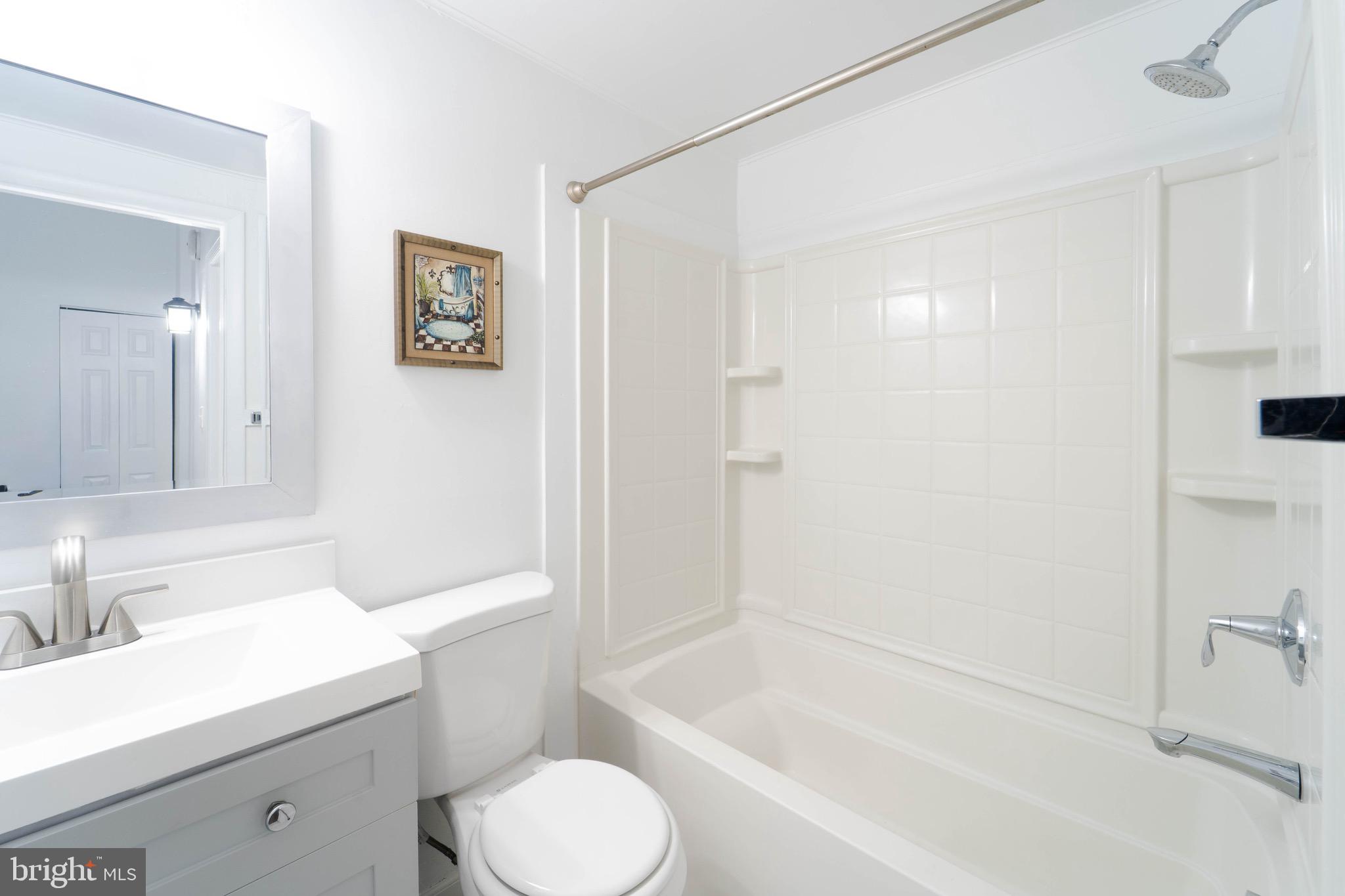 9318 Matador Road Columbia, MD 21045 - Photo 27 of 32 a bathroom with a sink toilet and shower