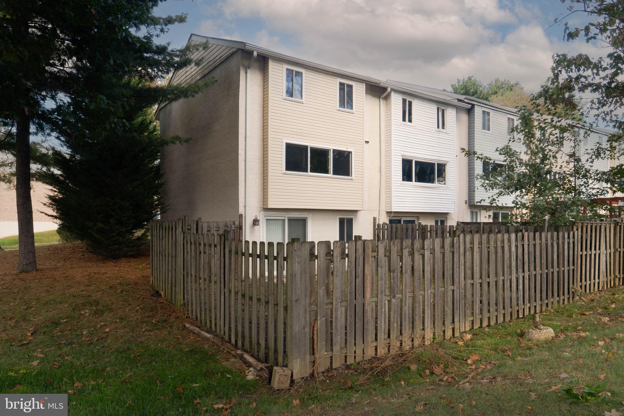 9318 Matador Road Columbia, MD 21045 - Photo 31 of 32 a white house that has tree in front of it