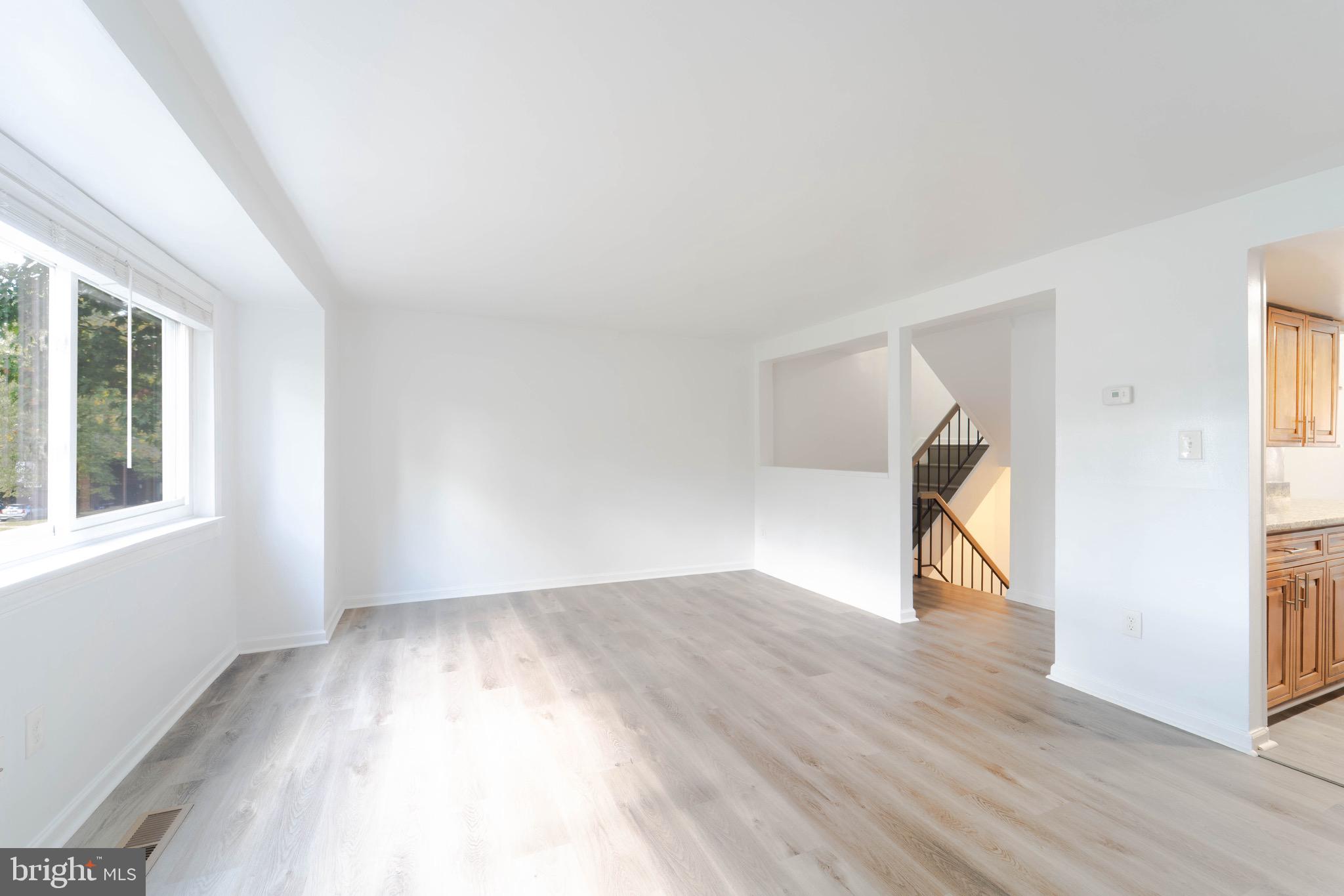 9318 Matador Road Columbia, MD 21045 - Photo 6 of 32 a view of empty room with wooden floor and fan