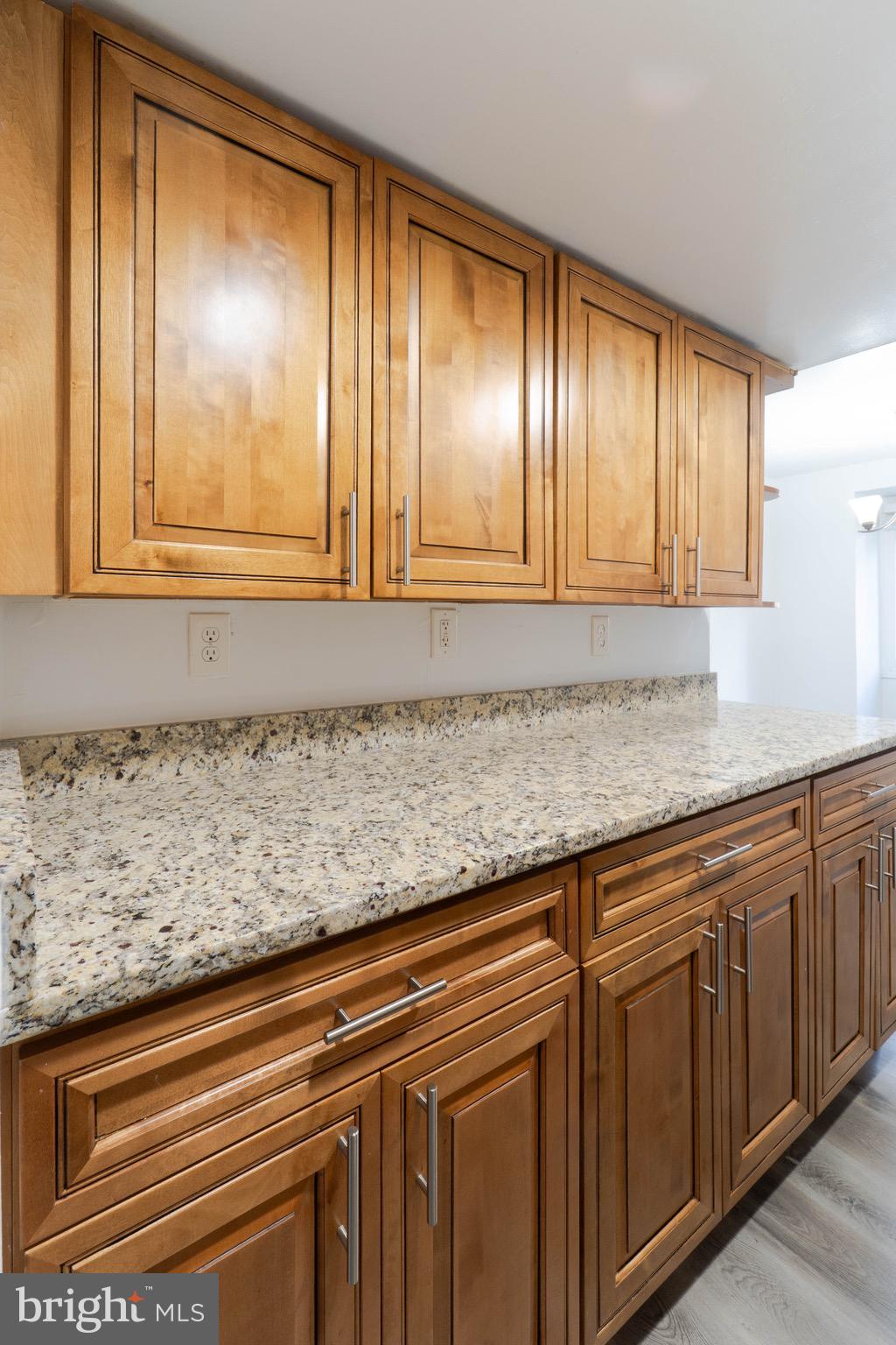 9318 Matador Road Columbia, MD 21045 - Photo 8 of 32 a view of a kitchen with granite countertop cabinets