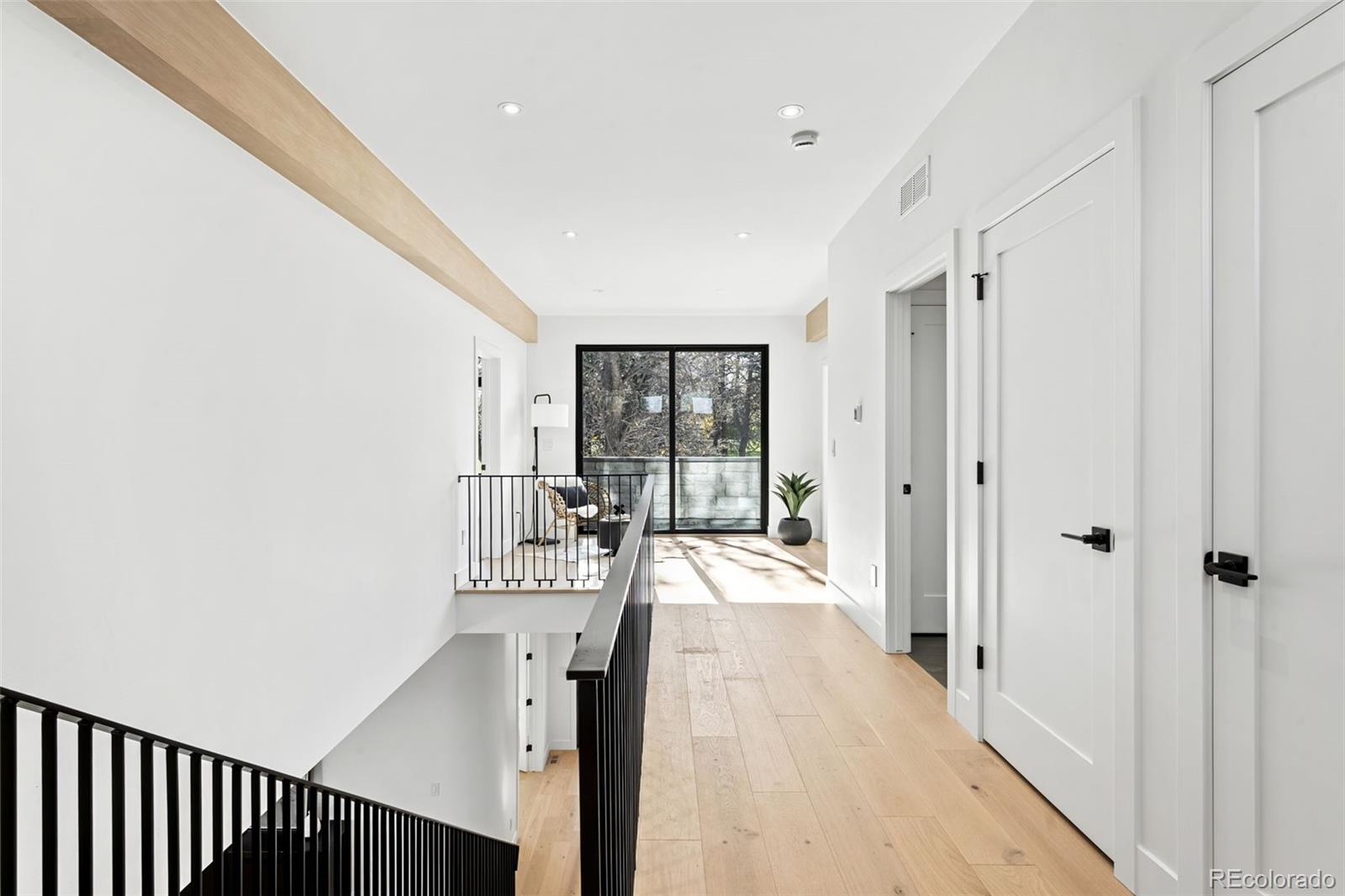 4645 Highline Place Denver, CO 80222 - Photo 16 of 48 a view of a hallway with a chandelier