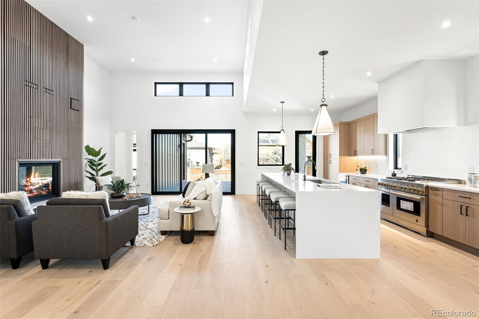 4645 Highline Place Denver, CO 80222 - Photo 20 of 48 a living room with furniture kitchen view and a large window