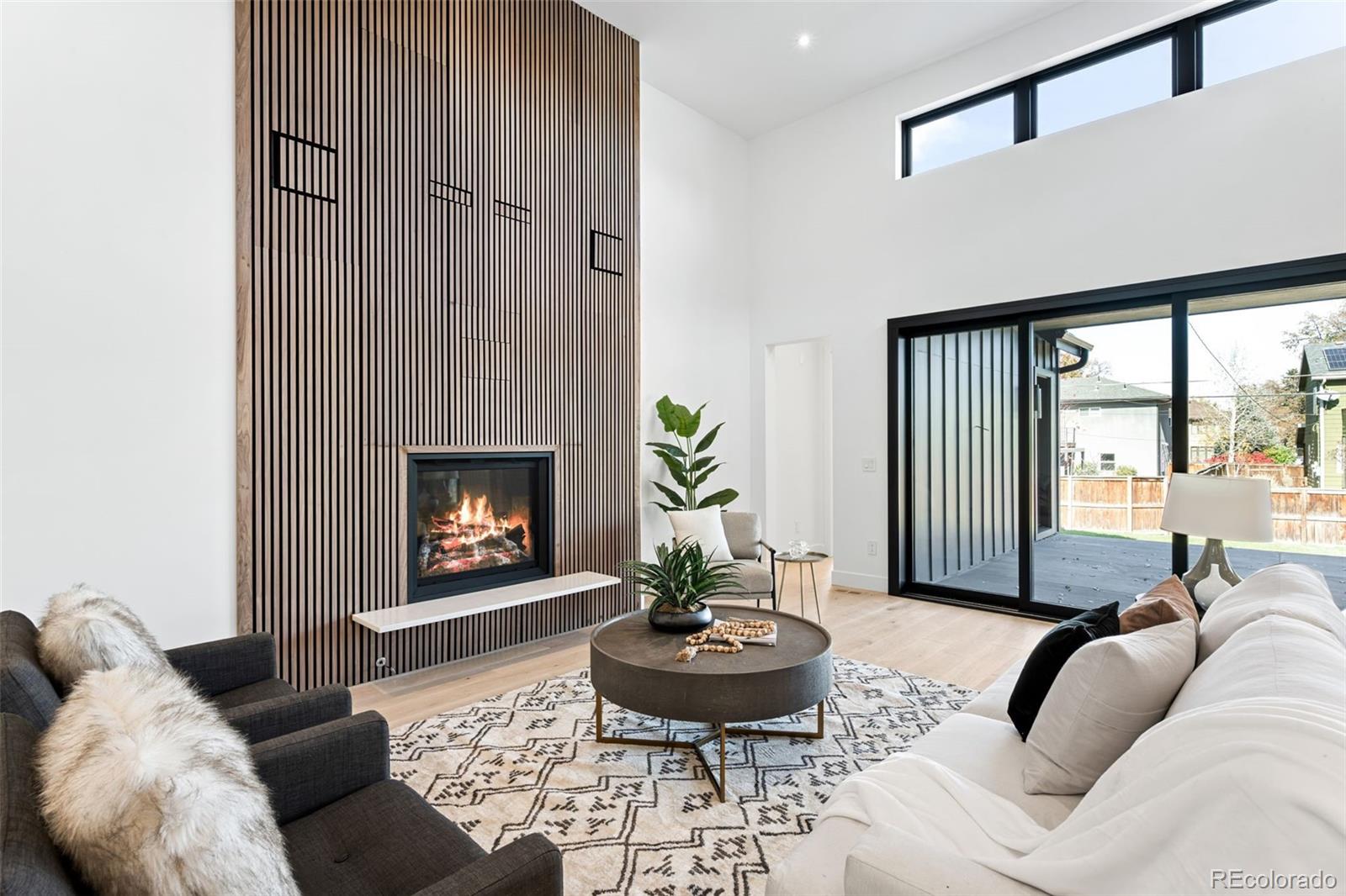 4645 Highline Place Denver, CO 80222 - Photo 21 of 48 a living room with furniture and a fireplace