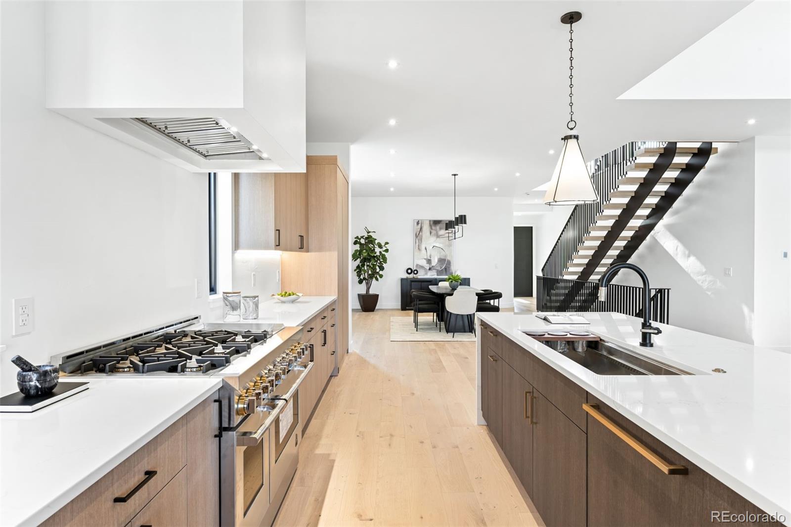 4645 Highline Place Denver, CO 80222 - Photo 25 of 48 a kitchen with a sink stove and cabinets