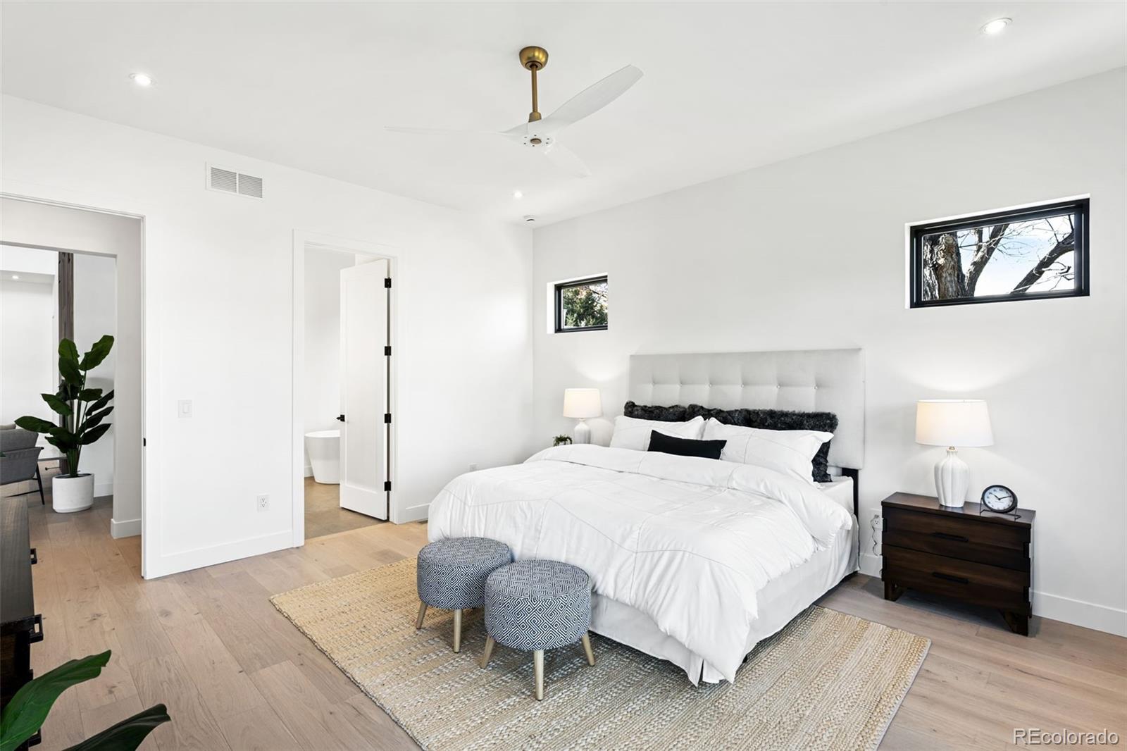 4645 Highline Place Denver, CO 80222 - Photo 26 of 48 a bedroom with a bed and a potted plant