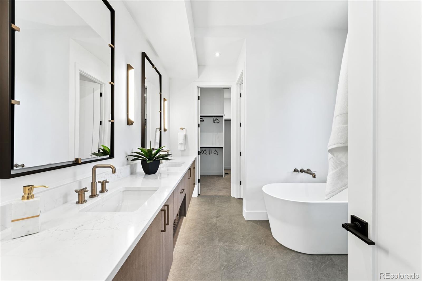 4645 Highline Place Denver, CO 80222 - Photo 28 of 48 a bathroom with a double vanity sink mirror and double