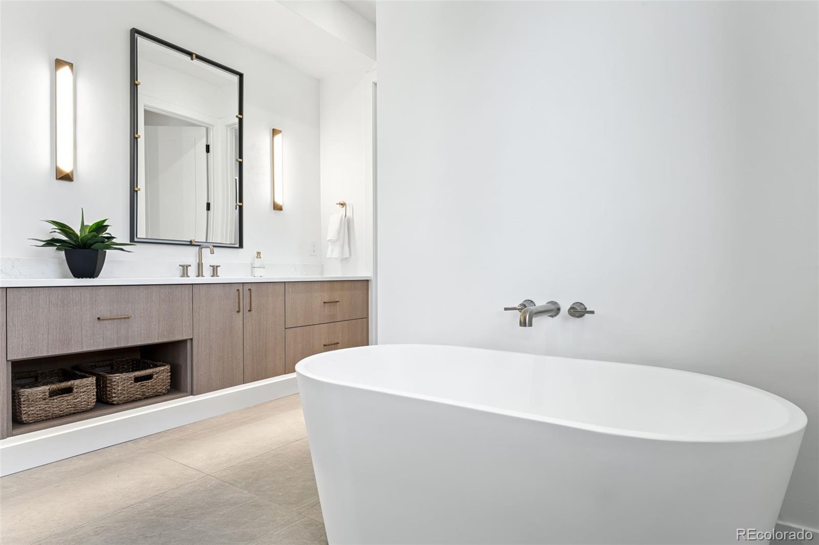 4645 Highline Place Denver, CO 80222 - Photo 29 of 48 a white bath tub sitting in a bathroom