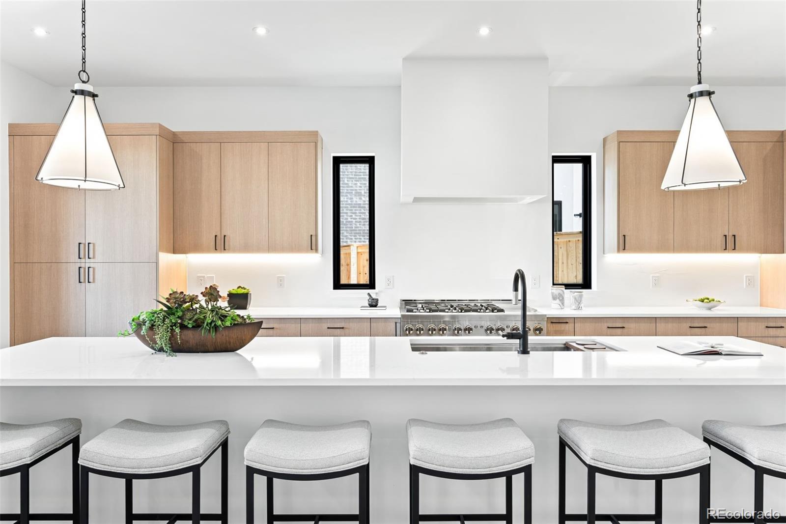 4645 Highline Place Denver, CO 80222 - Photo 7 of 48 a kitchen with a dining table and chairs