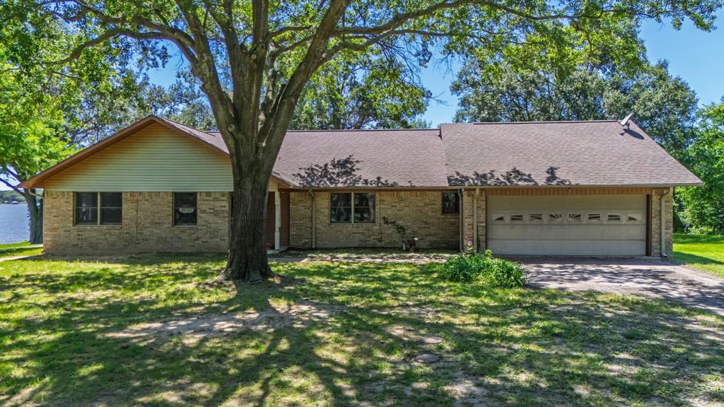 476 Private Road 7326 Emory, TX 75440 - Photo 16 of 33 a view of a house with a yard