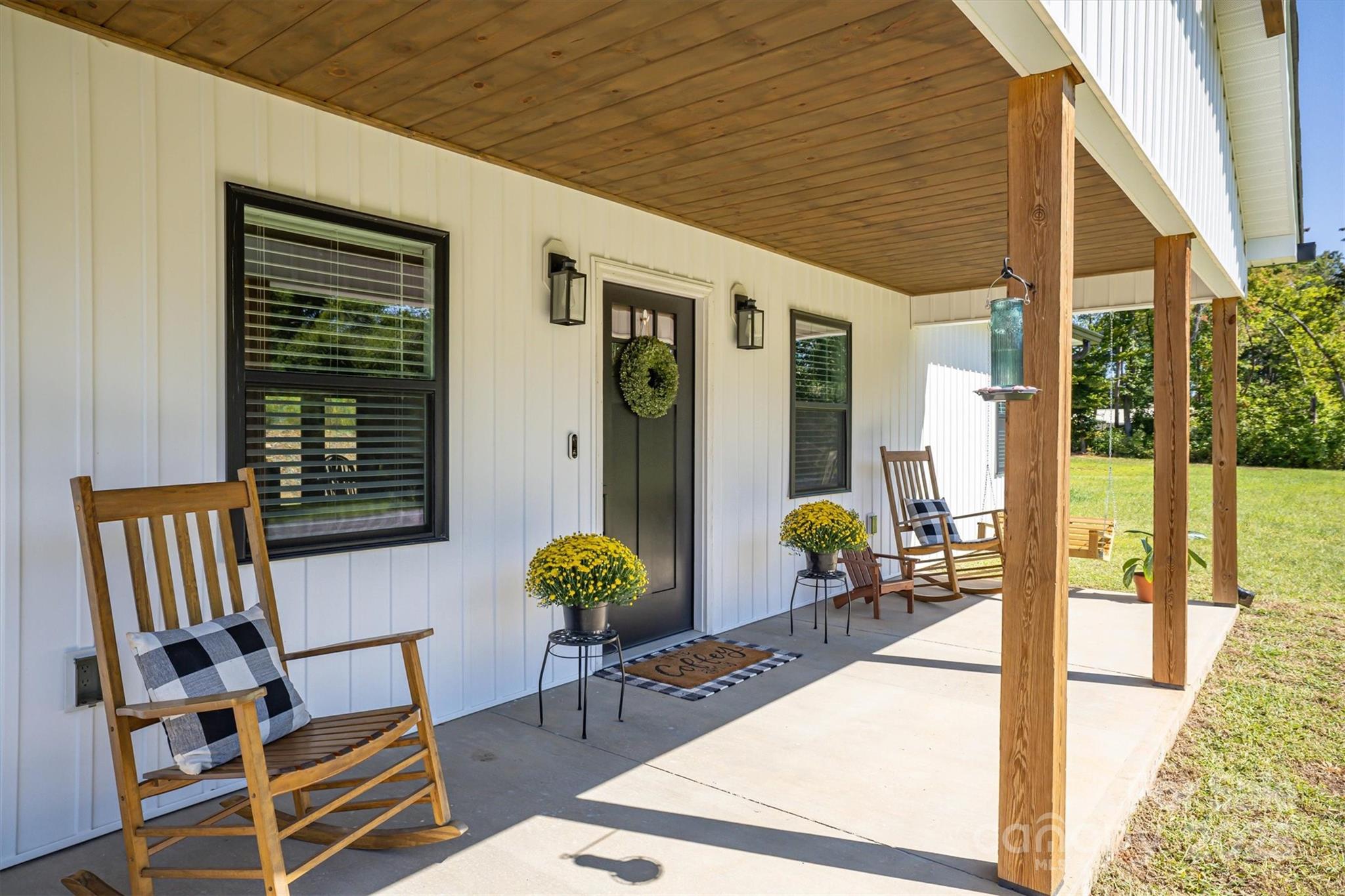 1173 Coffey Road Morganton, NC 28655 - Photo 2 of 26 a view of a patio with table and chairs and potted plants