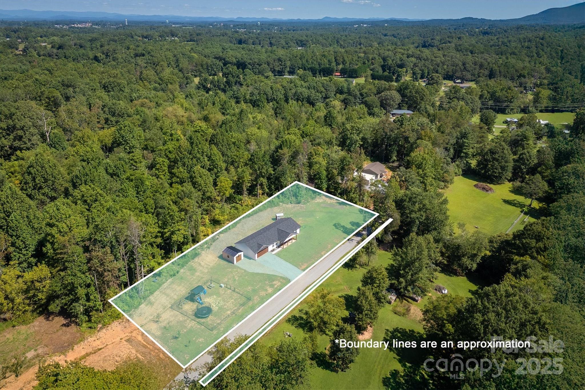 1173 Coffey Road Morganton, NC 28655 - Photo 26 of 26 an aerial view of a golf course with a yard