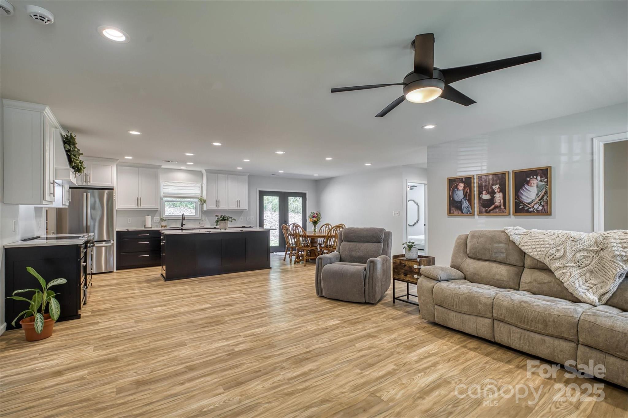1173 Coffey Road Morganton, NC 28655 - Photo 4 of 26 a living room with furniture kitchen view and a wooden floor