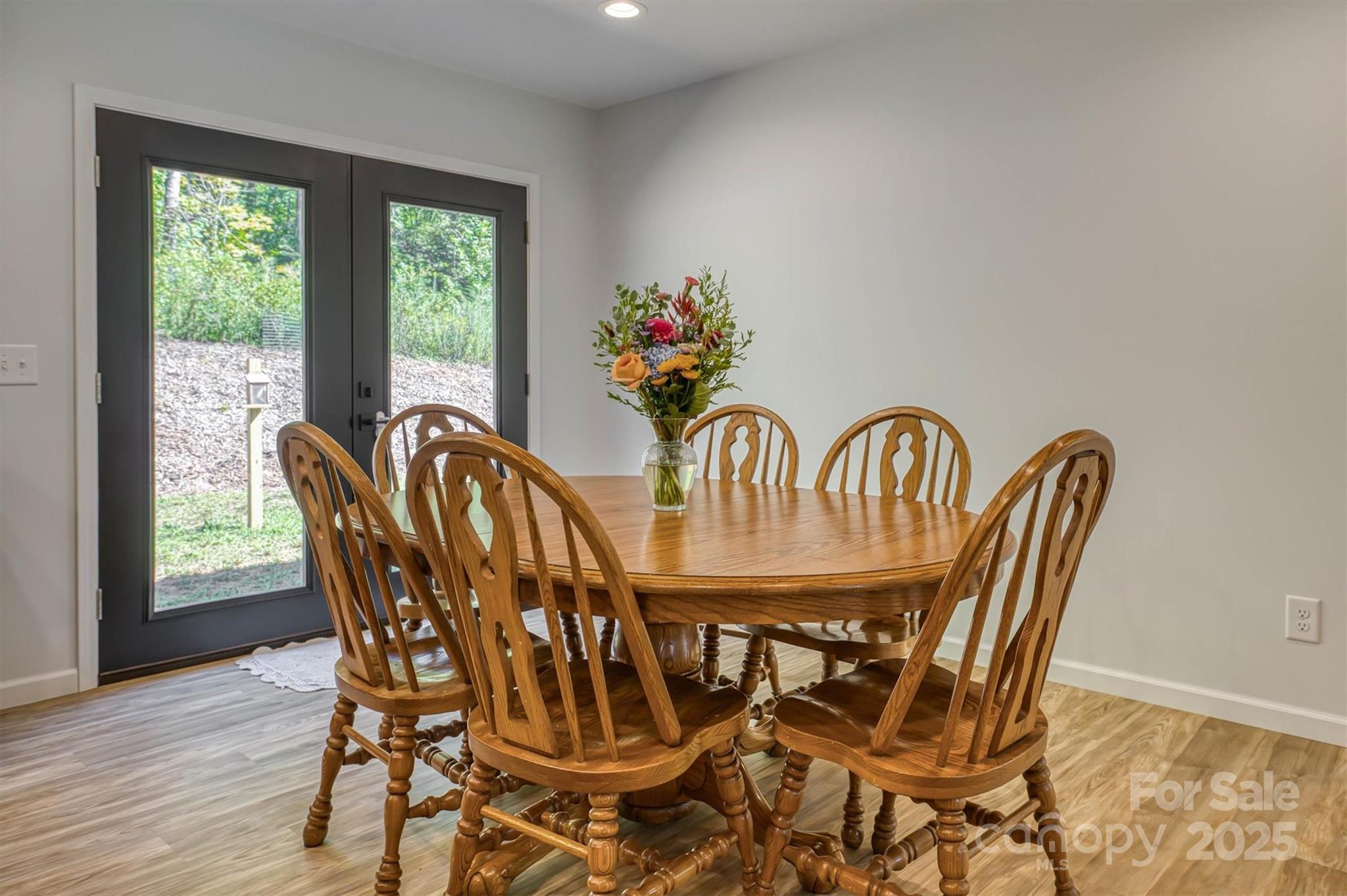 1173 Coffey Road Morganton, NC 28655 - Photo 9 of 26 a view of a dining room with furniture wooden floor and chandelier
