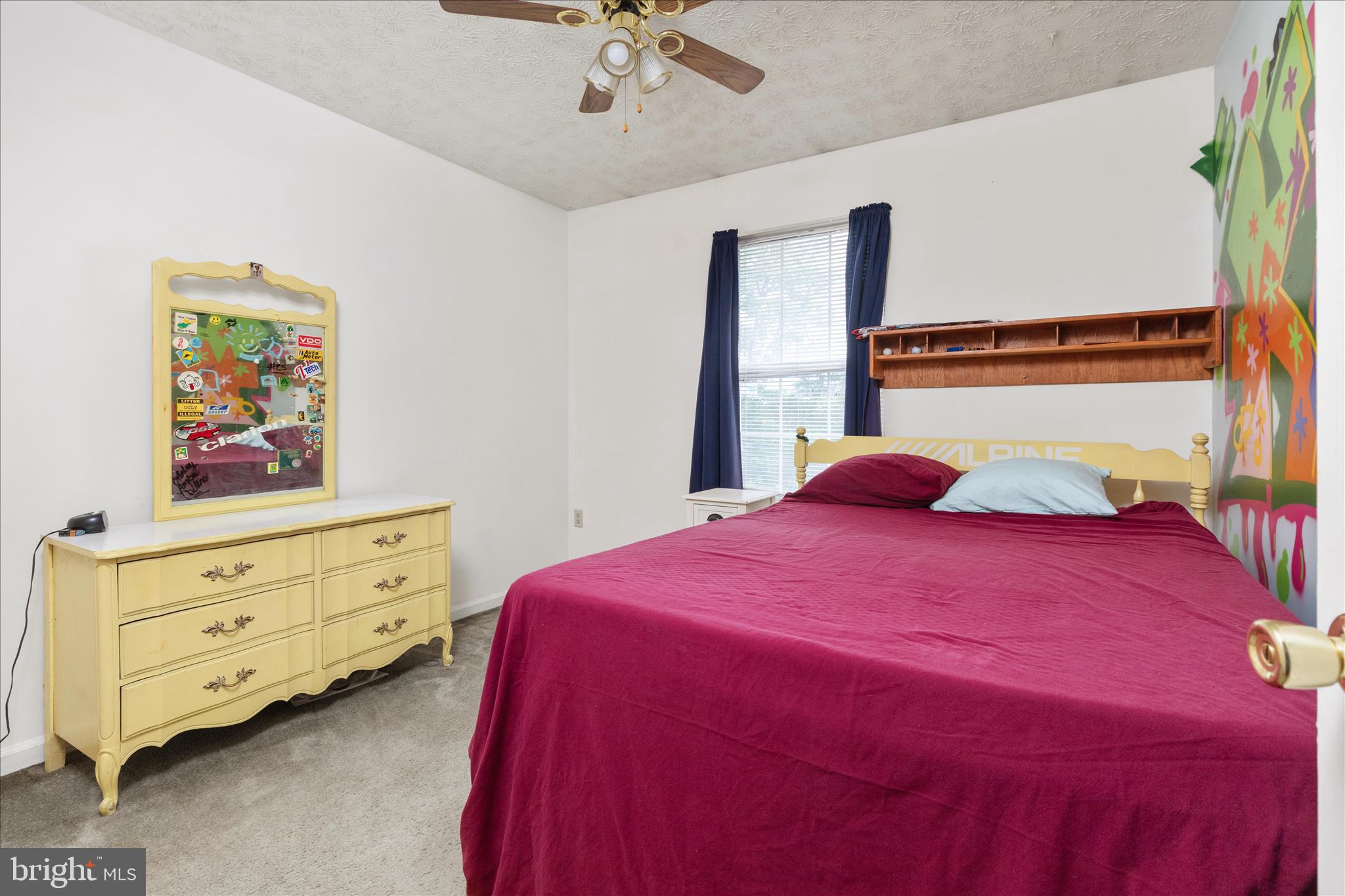 132 Stadium Circle Inwood, WV 25428 - Photo 13 of 25 a bedroom with a bed and a dresser