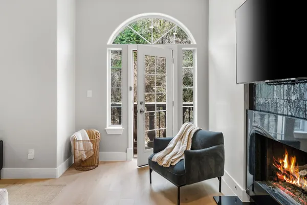 a living room with furniture and kitchen view