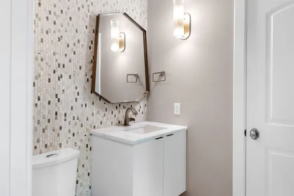 a living room with wooden floors and a couch