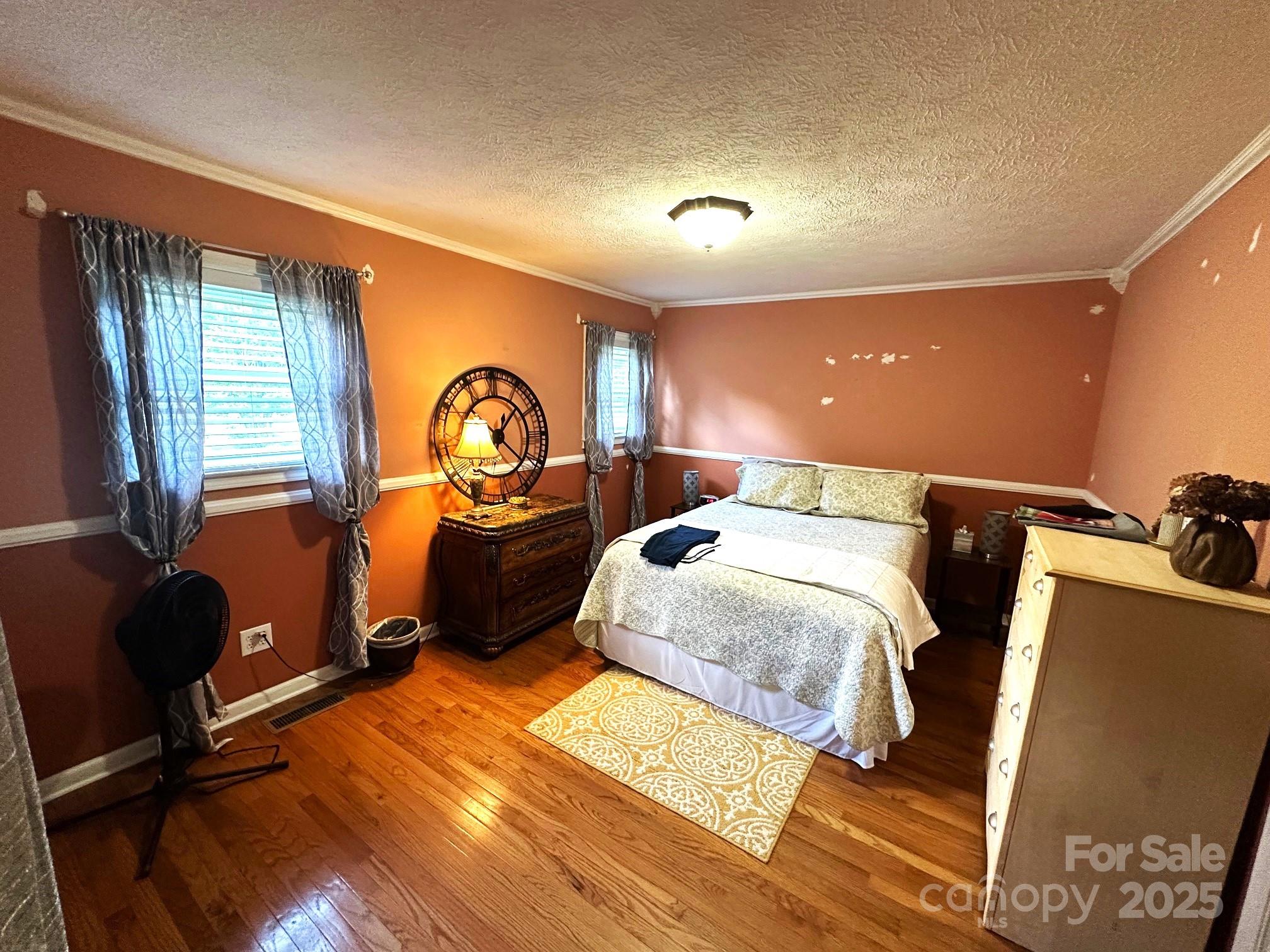 25 Norman Road Fletcher, NC 28732 - Photo 24 of 47 a bed room with a bed and a dresser