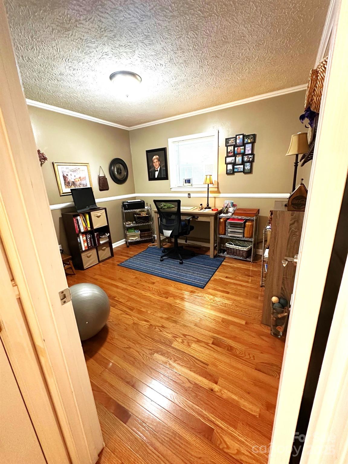 25 Norman Road Fletcher, NC 28732 - Photo 28 of 47 a living room with furniture and a wooden floor