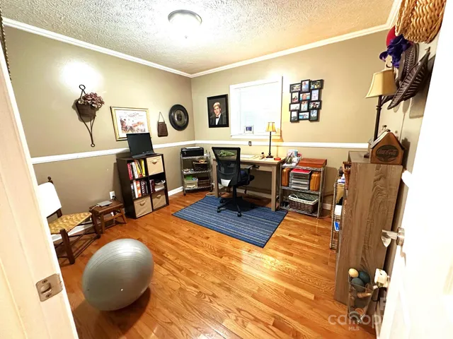 a bathroom with a sink toilet a mirror and shower