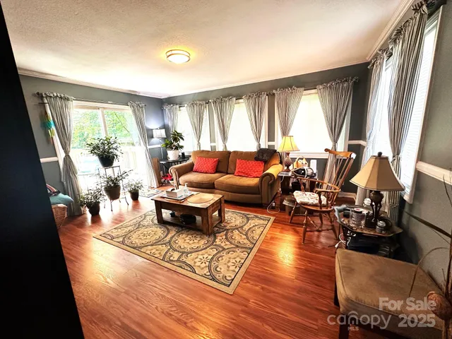 a view of deck with furniture and umbrella