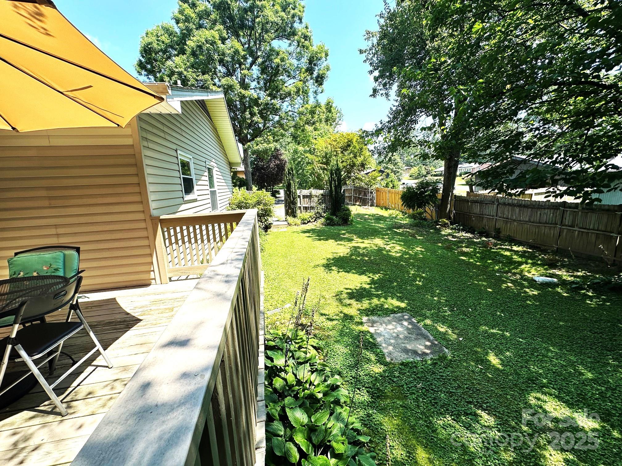 25 Norman Road Fletcher, NC 28732 - Photo 35 of 47 a view of backyard of house with seating area