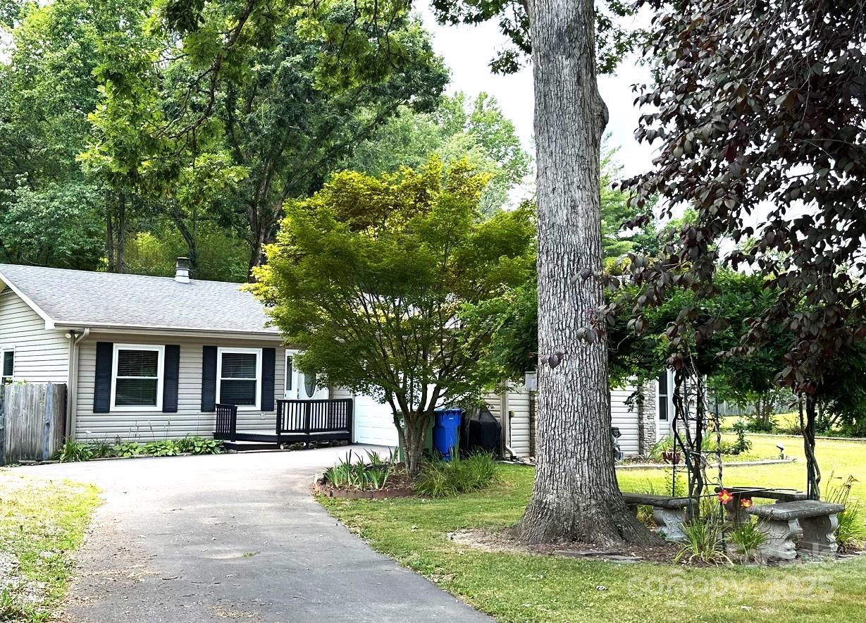 25 Norman Road Fletcher, NC 28732 - Photo 36 of 47 a tree in front of a white house