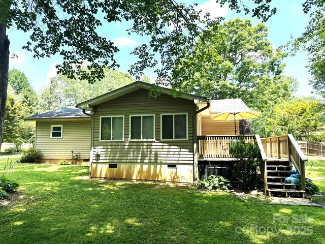 a view of a small yard with wooden fence
