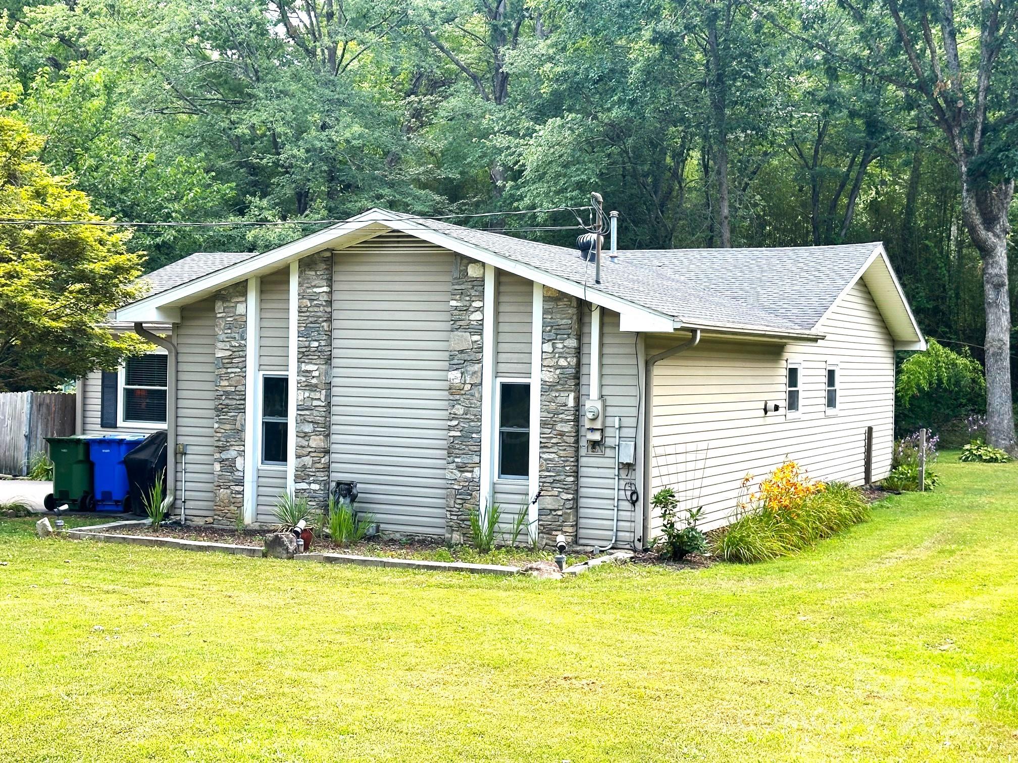 25 Norman Road Fletcher, NC 28732 - Photo 4 of 47 a view of a house with pool and chairs