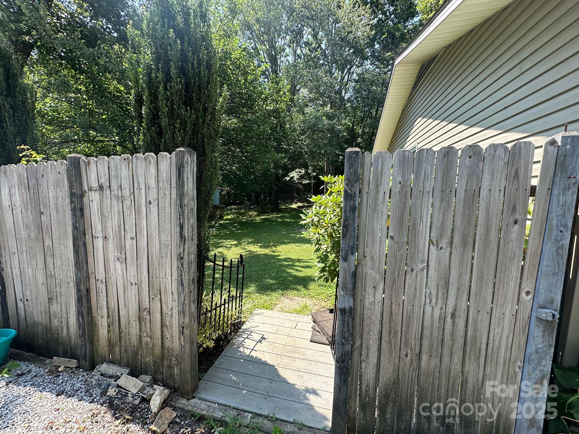 25 Norman Road Fletcher, NC 28732 - Photo 41 of 47 a view of a small yard with wooden fence