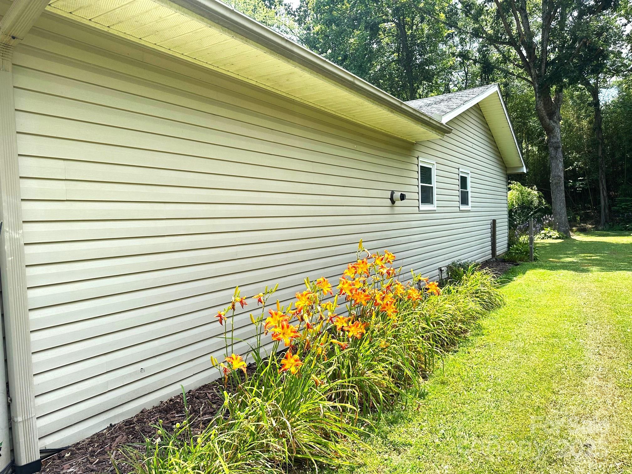 25 Norman Road Fletcher, NC 28732 - Photo 45 of 47 a view of a backyard with plants and trees