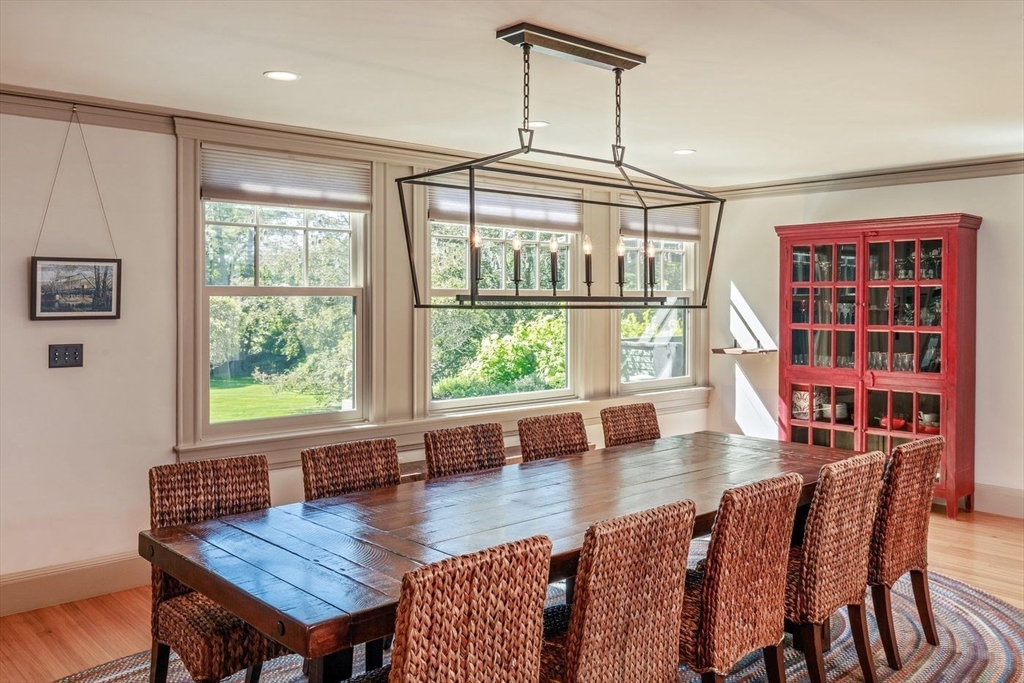 450 Summer Street Manchester, MA 01944 - Photo 12 of 42 a view of a dining room with furniture and a window