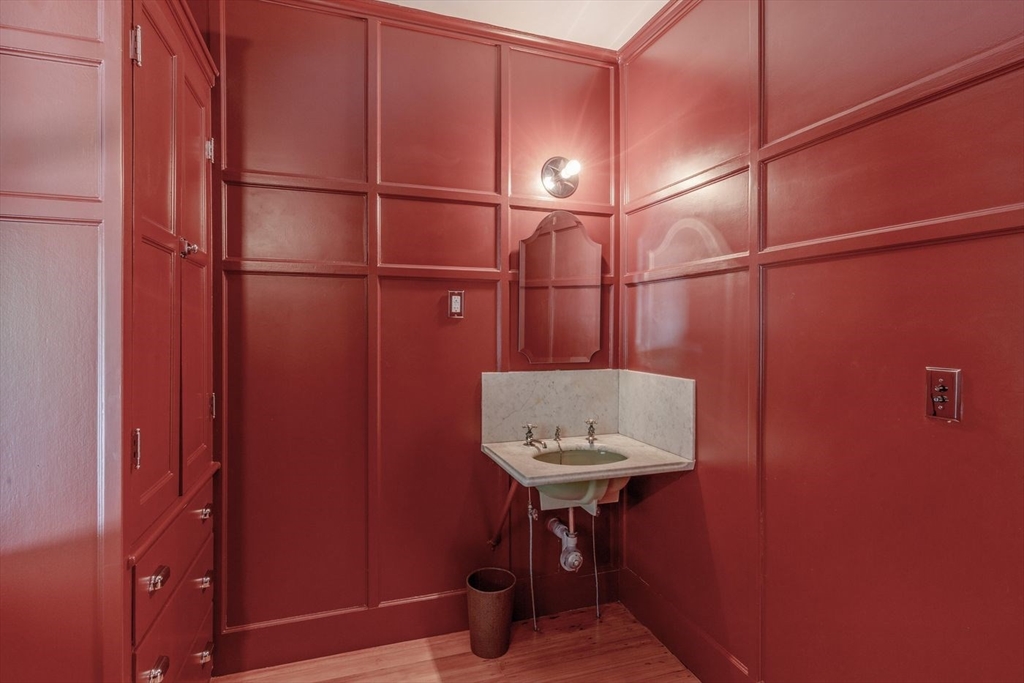 450 Summer Street Manchester, MA 01944 - Photo 15 of 42 a bathroom with a sink and a mirror