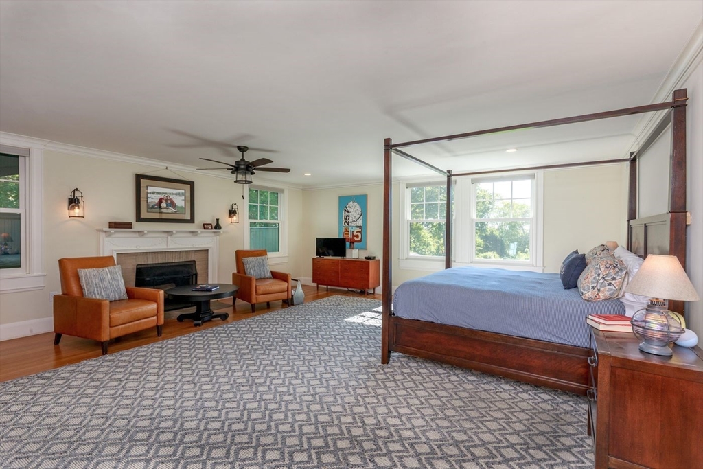 450 Summer Street Manchester, MA 01944 - Photo 17 of 42 a bedroom with furniture and a fireplace