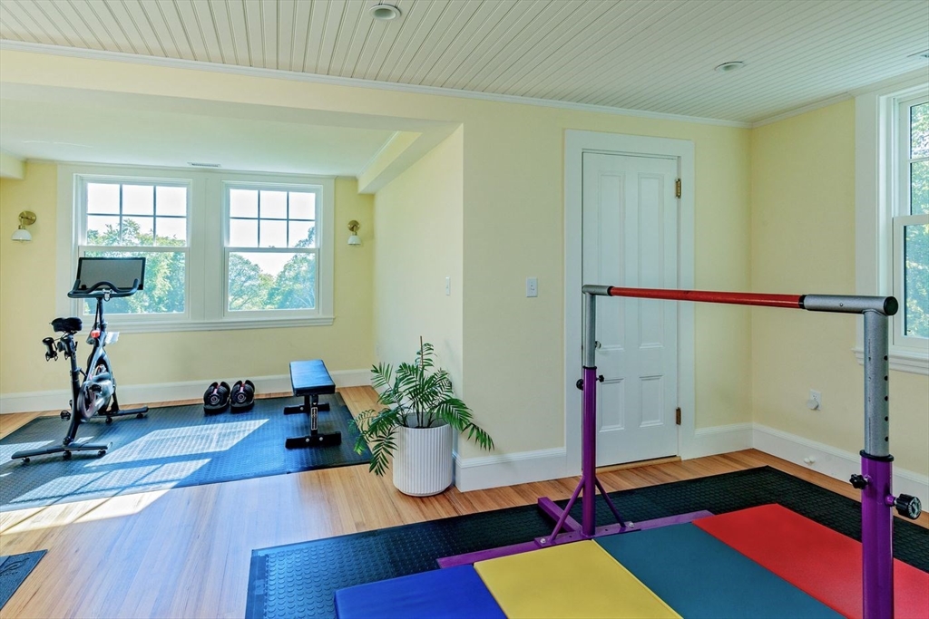 450 Summer Street Manchester, MA 01944 - Photo 28 of 42 a room with lots of white walls and wooden floor
