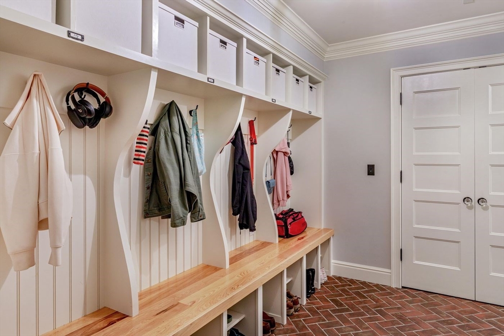 450 Summer Street Manchester, MA 01944 - Photo 29 of 42 a view of walk in closet with clothes and shoes