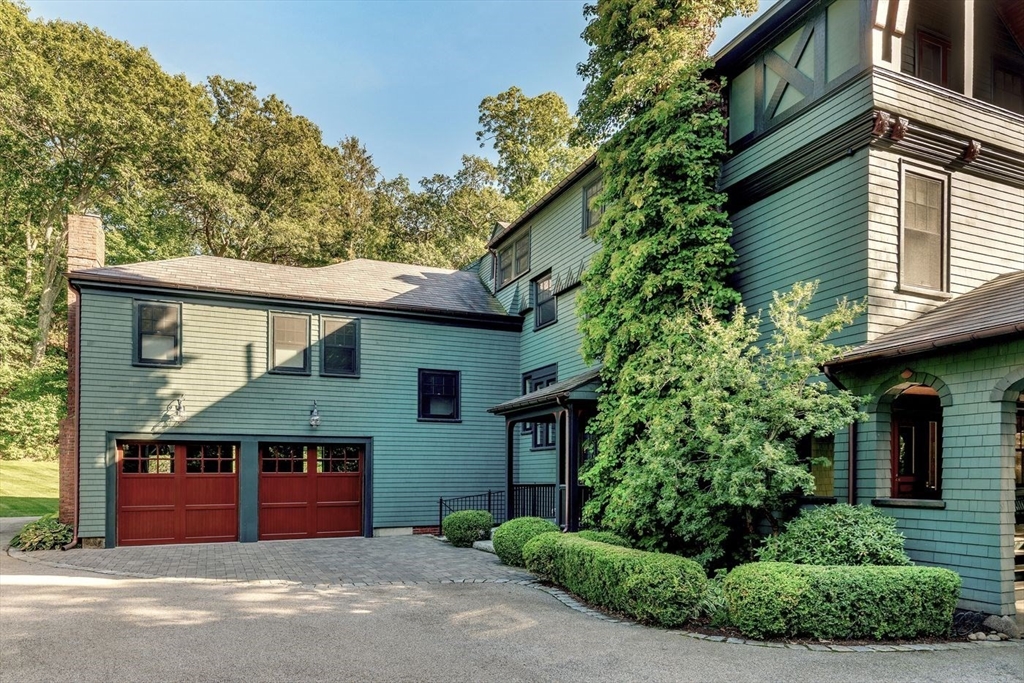 450 Summer Street Manchester, MA 01944 - Photo 40 of 42 a front view of a house with a garden