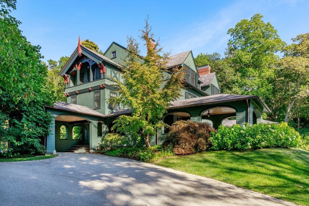 450 Summer Street Manchester, MA 01944 - Photo 5 of 42 a front view of a house with garden