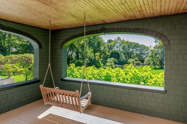 a view of a two chairs in the balcony