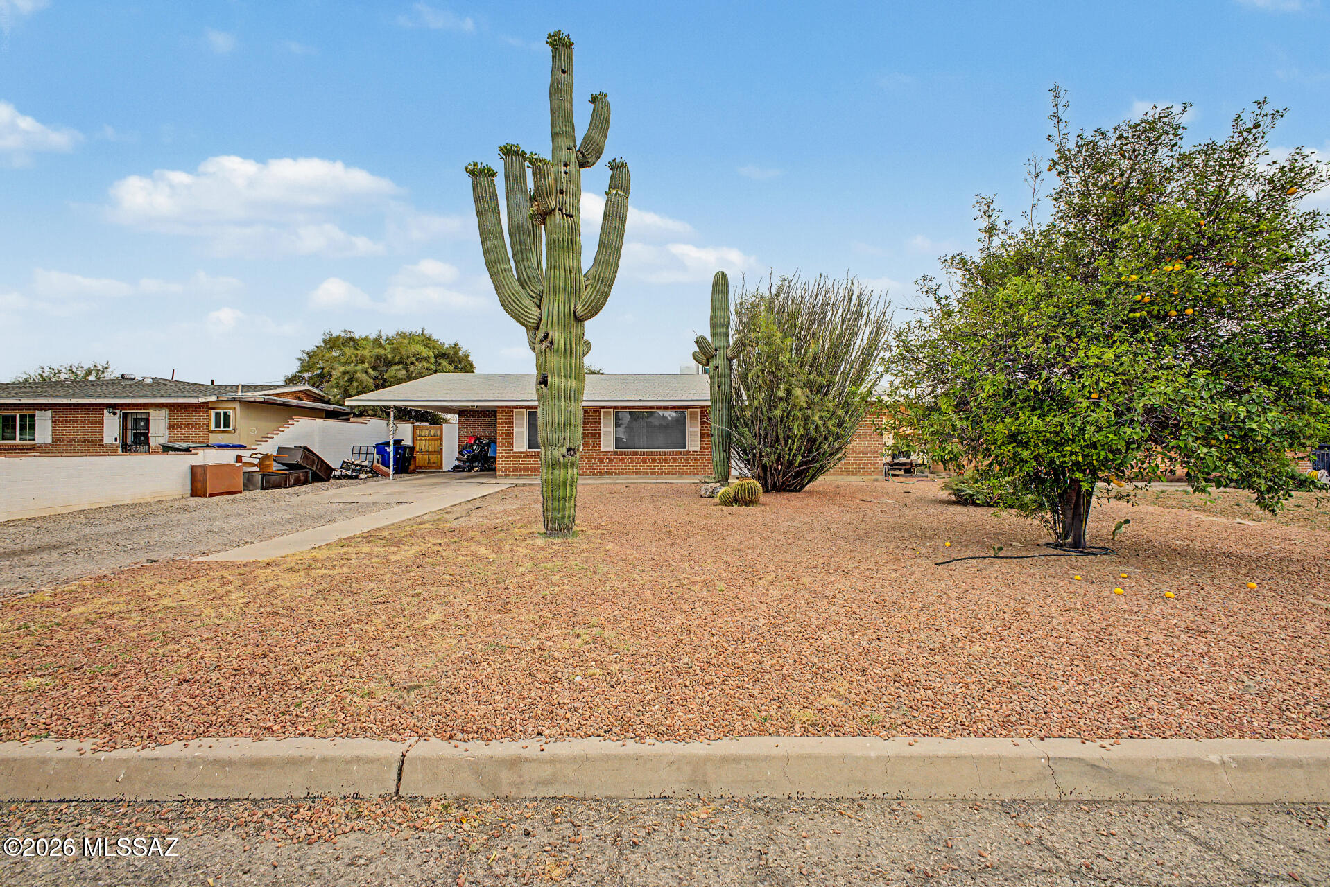 1172 East Allen Road Tucson, AZ 85719 - Photo 3 of 25 a front view of a house with garden