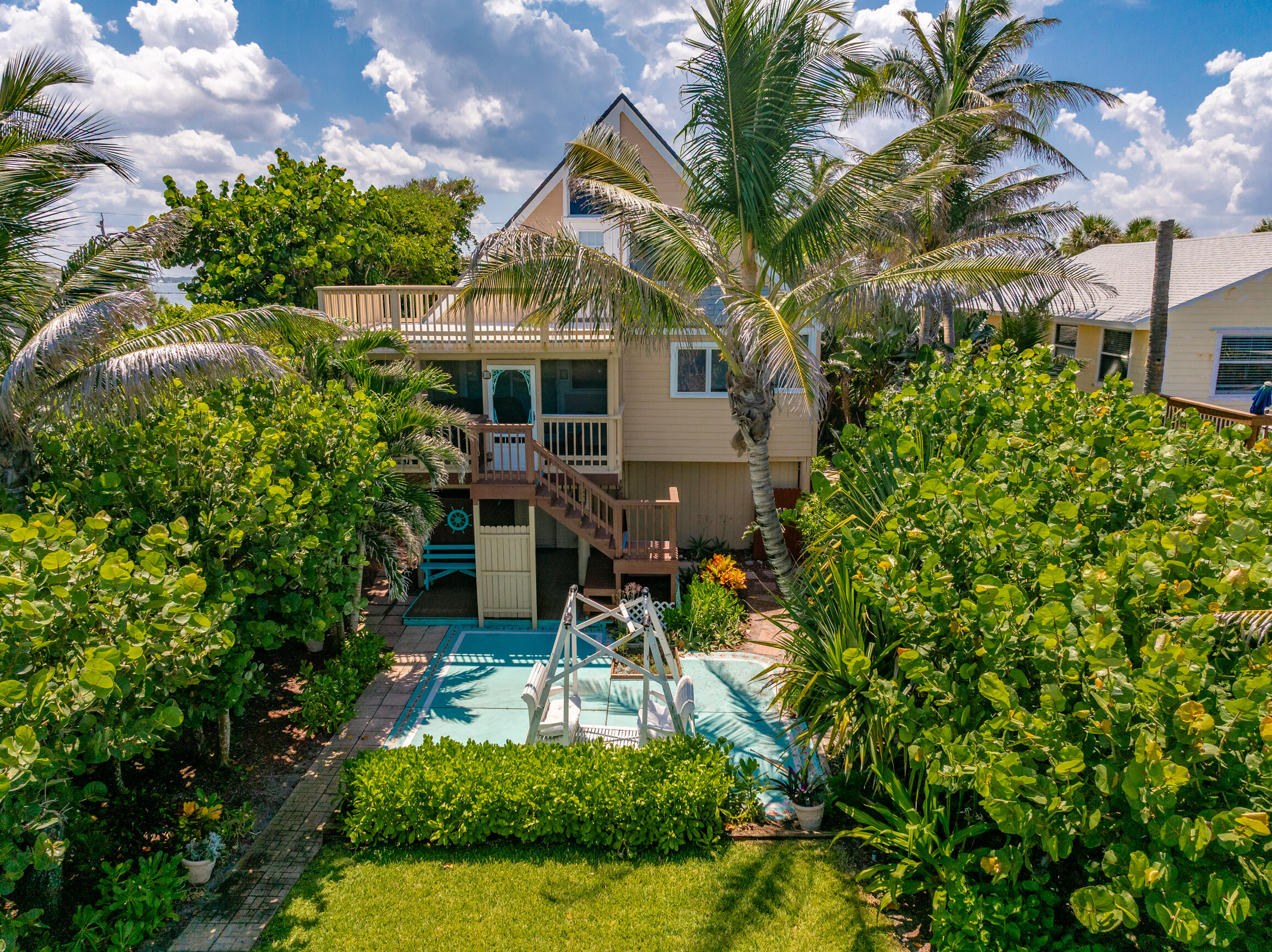 12946 Florida A1A Vero Beach, FL 32963 - Photo 18 of 29 a aerial view of a house with a yard and potted plants