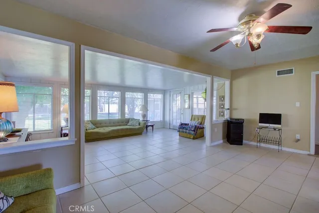 a view of a living room and chandelier