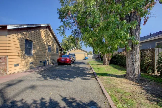 a view of a house with a yard and garage