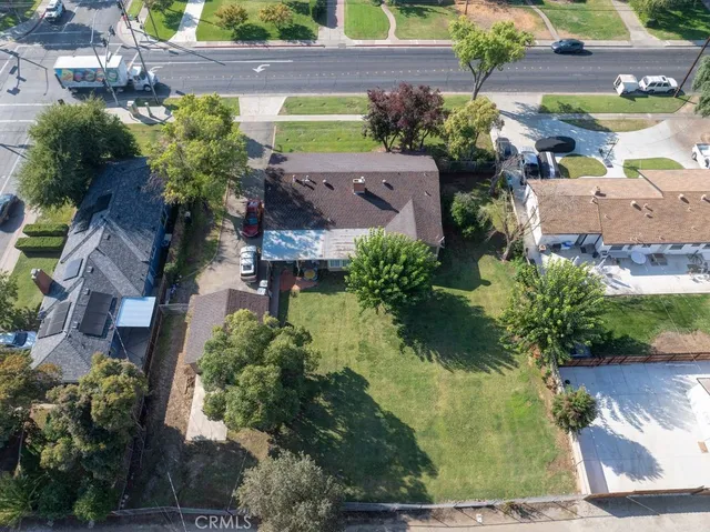 an aerial view of a house with a yard