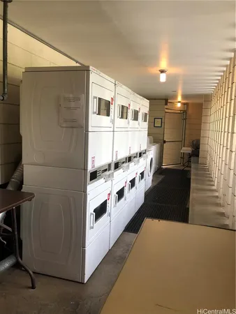a kitchen with stainless steel appliances a refrigerator and a stove