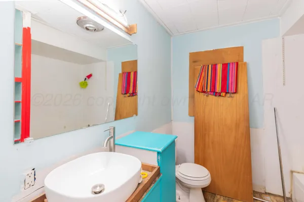 a bathroom with a bath tub and a toilet