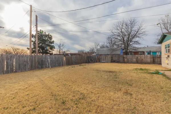 a view of a backyard of the house